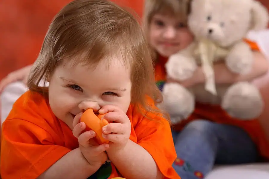 Young girl with Down Syndrome enjoying playing